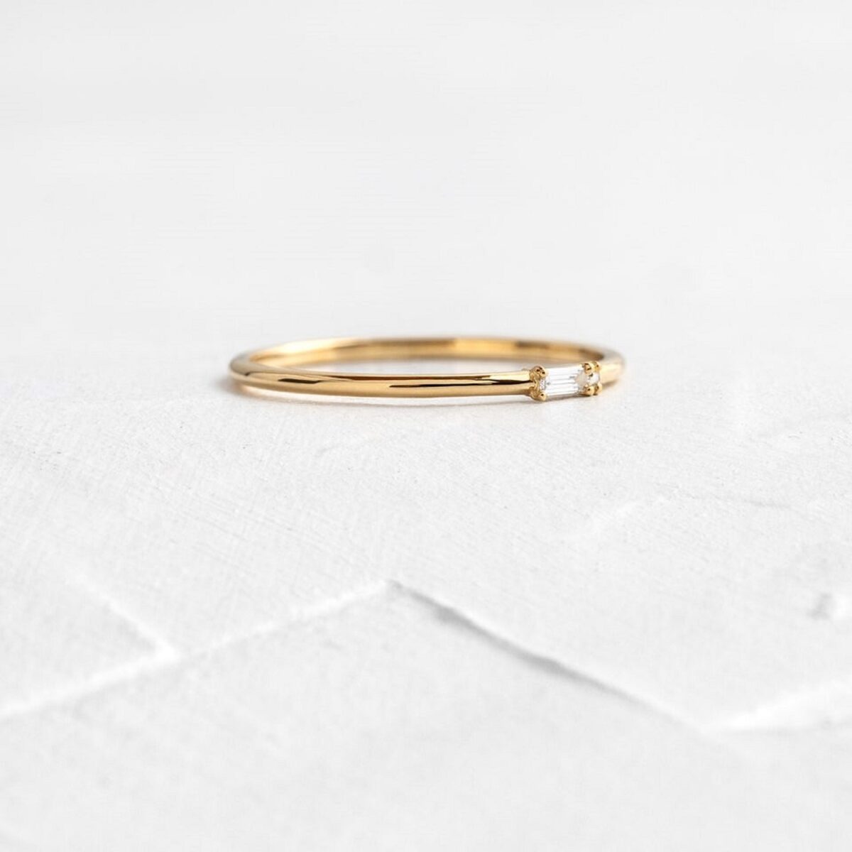 Baguette cut lab grown diamond ring crafted in solid 14k yellow gold.