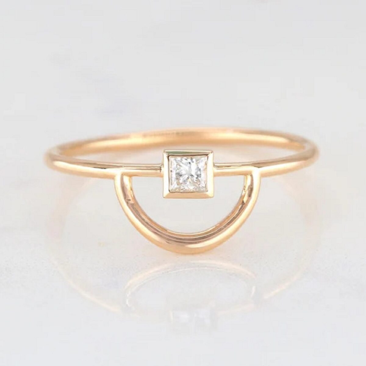 Bezel set 0.10 carat princess cut lab grown diamond solitaire ring crafted in 14k yellow gold