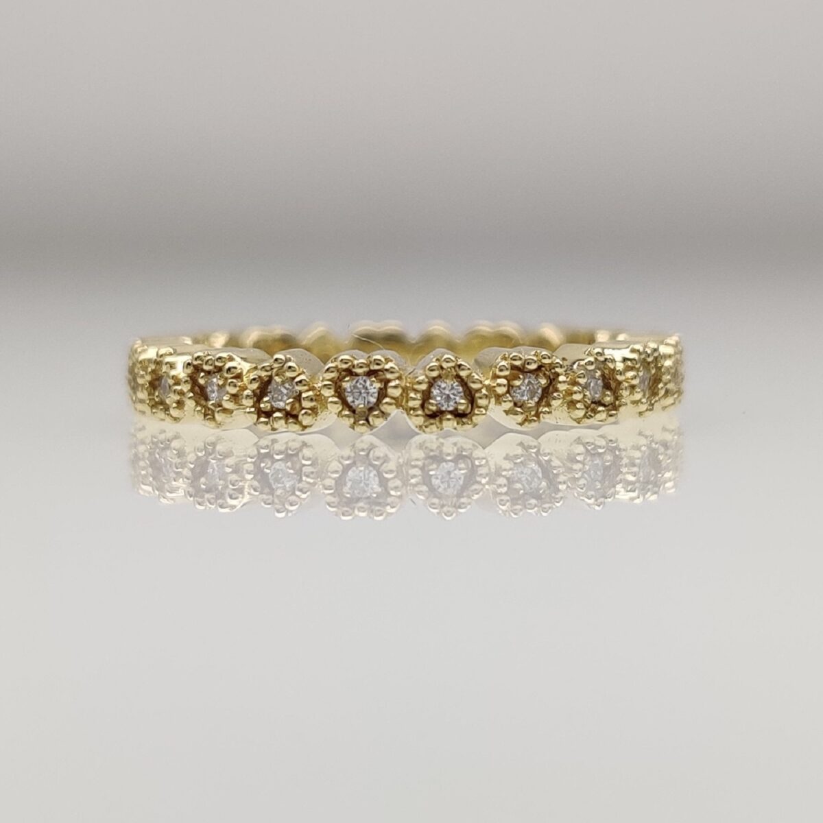 Heart shaped round cut milgrain set lab grown diamond wedding band in 14k yellow gold