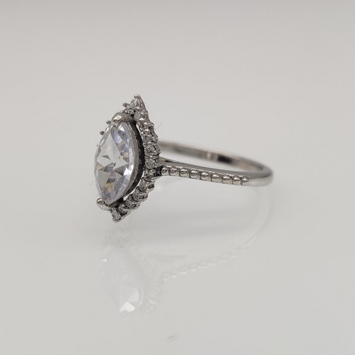 Marquise cut lab grown diamond halo engagement ring crafted in 14k solid white gold.
