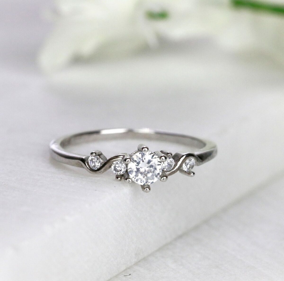 Five stone set round cut lab grown diamond engagement ring crafted in 14k white gold.