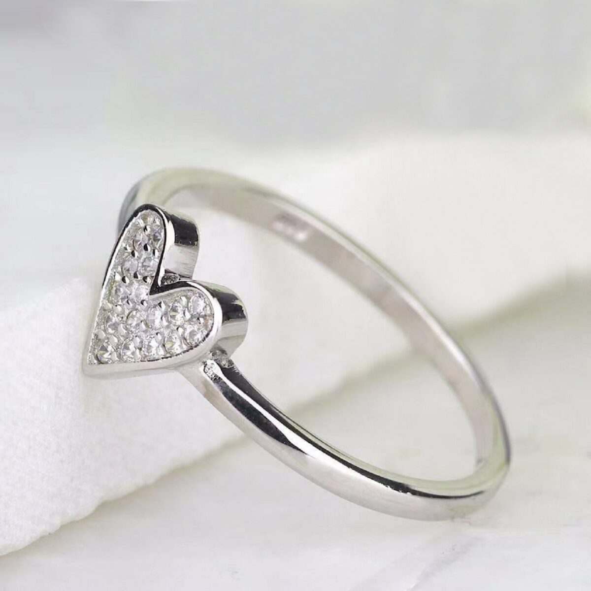 Unique illusion heart shaped round cut lab grown diamond statement ring crafted in 14k white gold.