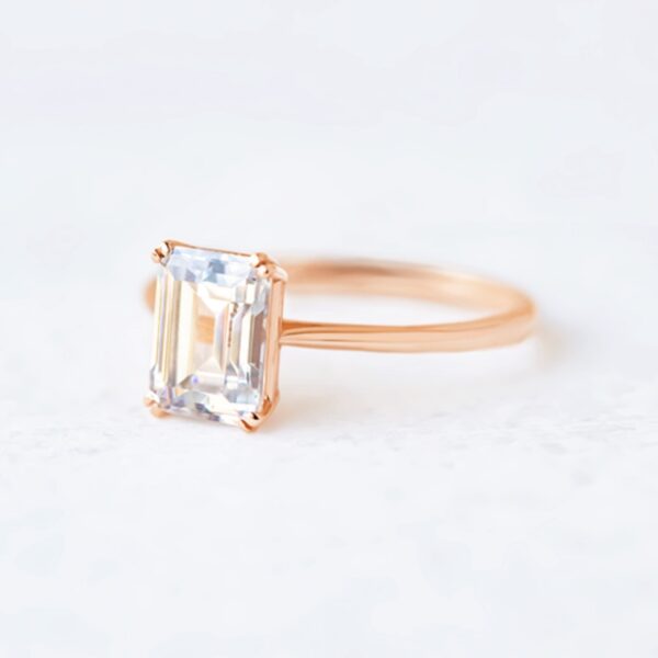 Solitaire emerald cut diamond ring