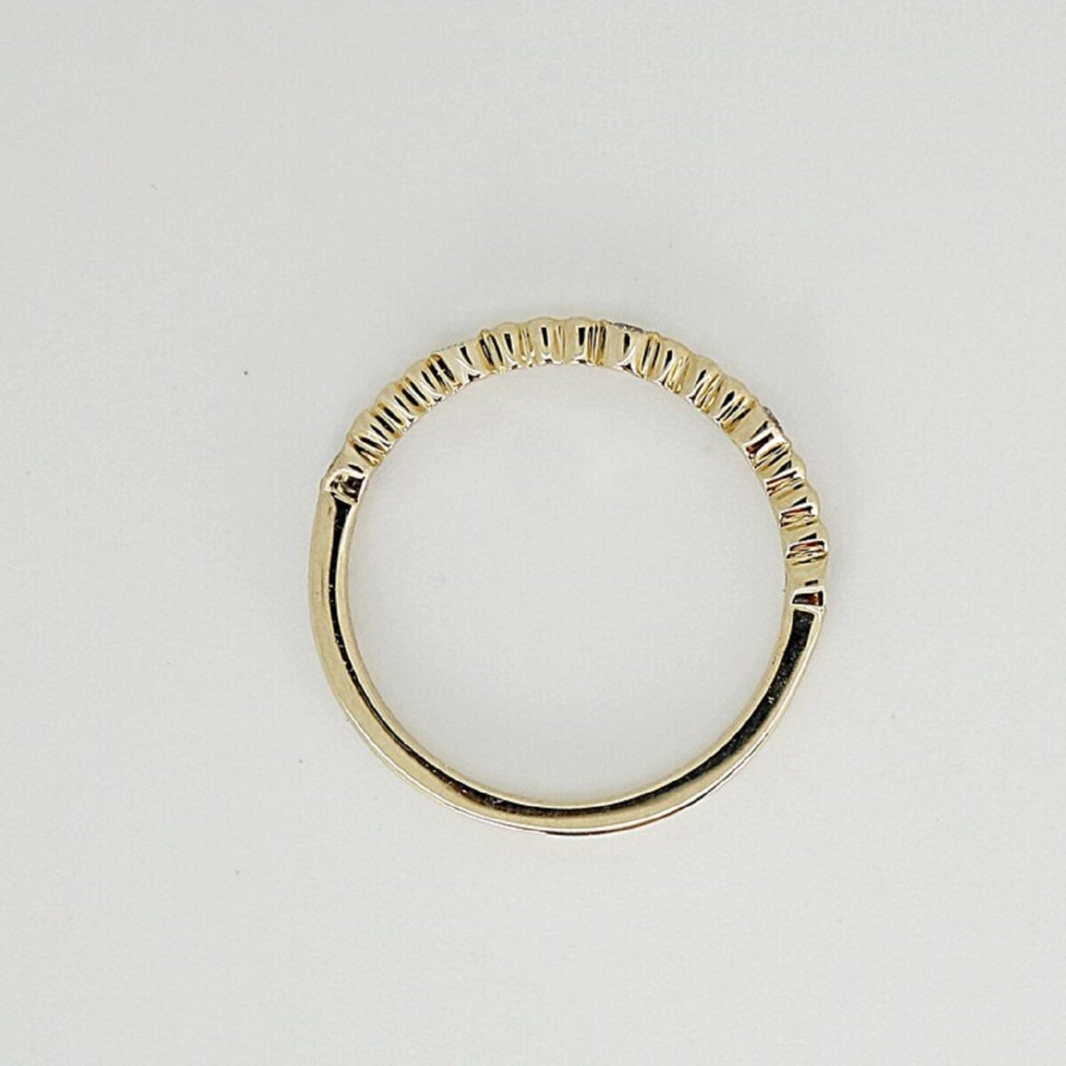 Unique round cut lab grown diamond stacking that milgrain setting around diamond and set between gold bead. This crafted in 14k yellow gold.