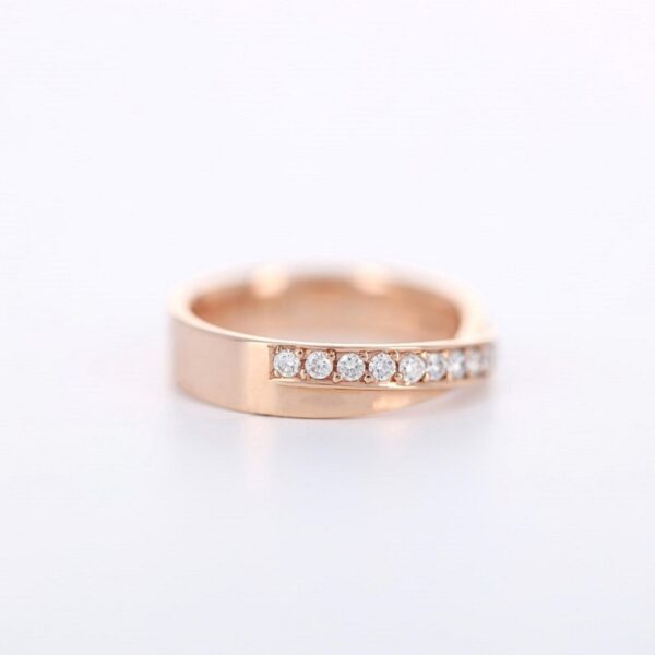 Round cut lab grown diamond channel setting unisex wedding ring crafted in 14k yellow gold.