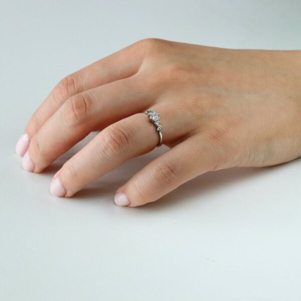 Five stone set round cut lab grown diamond engagement ring crafted in 14k white gold.
