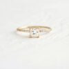 Tiny cushion cut lab grown diamond ring with accent round diamond as pave set on band crafted in 14k yellow gold.