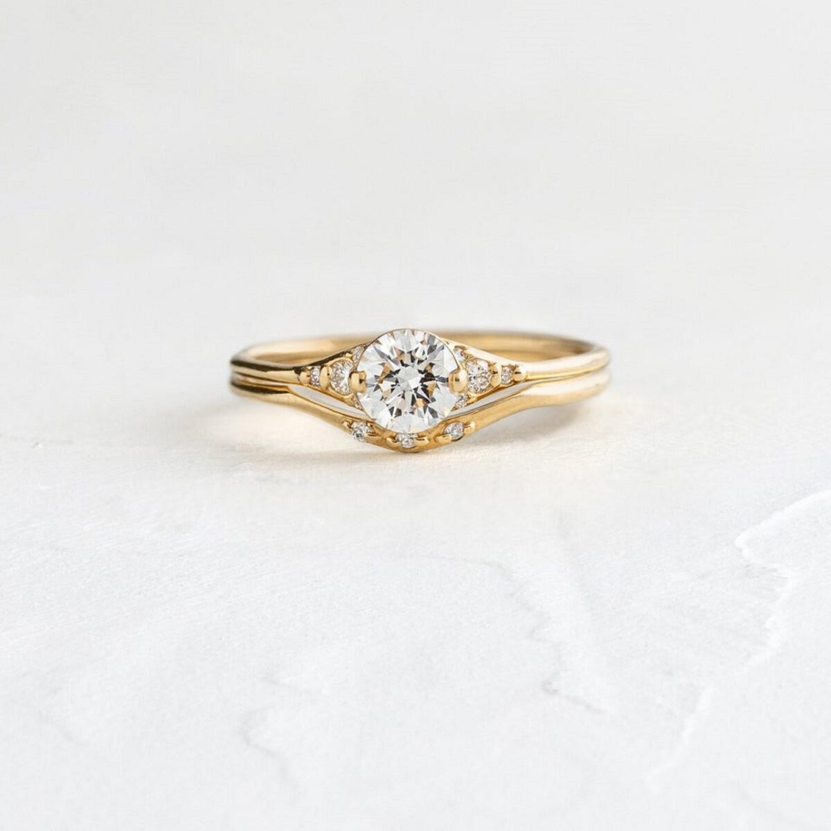 Round cut minimal lab grown diamond curved stackable ring crafted in 14k yellow gold