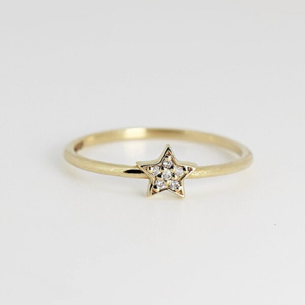 Unique star shaped round cut lab grown diamond statement ring in 14k yellow gold.