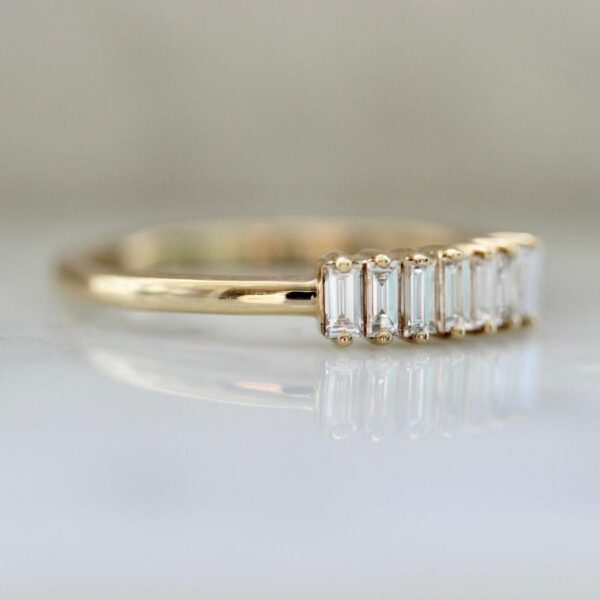 Seven stone baguette cut lab grown diamond wedding ring crafted in 14k yellow gold.