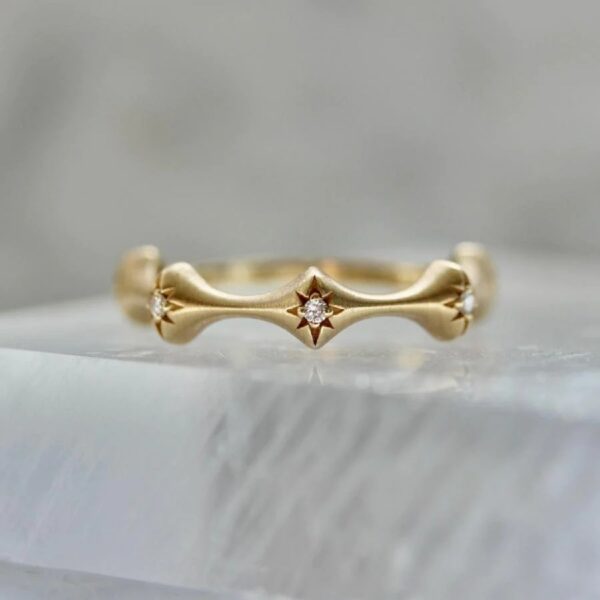 Round cut colorless lab grown diamond wedding band crafted in 14k yellow gold as fairy diamond band