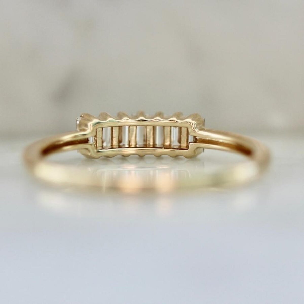Seven stone baguette cut lab grown diamond wedding ring crafted in 14k yellow gold.