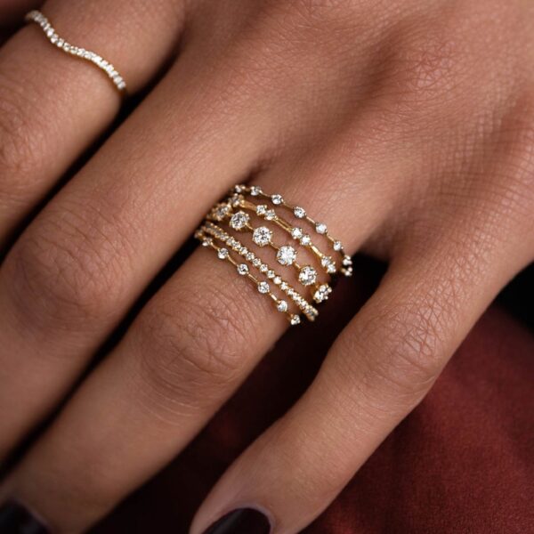 Petite twig style stackable round cut lab grown diamond wedding band crafted in 14k yellow gold.