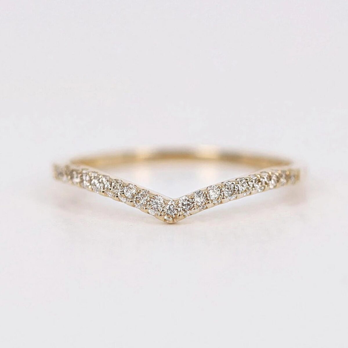round cut diamond wedding band crafted in 18K yellow gold