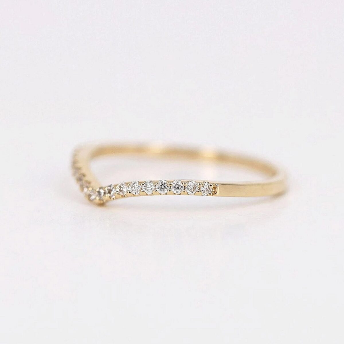 Minimalist style round cut lab grown diamond wedding band crafted in 18K yellow gold