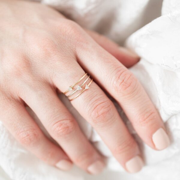 Minimalist style tiny trilliant engagement lab grown diamond ring crafted 14k yellow gold.
