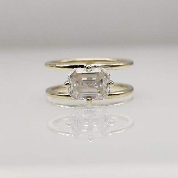 East west emerald cut moissanite with double band ring