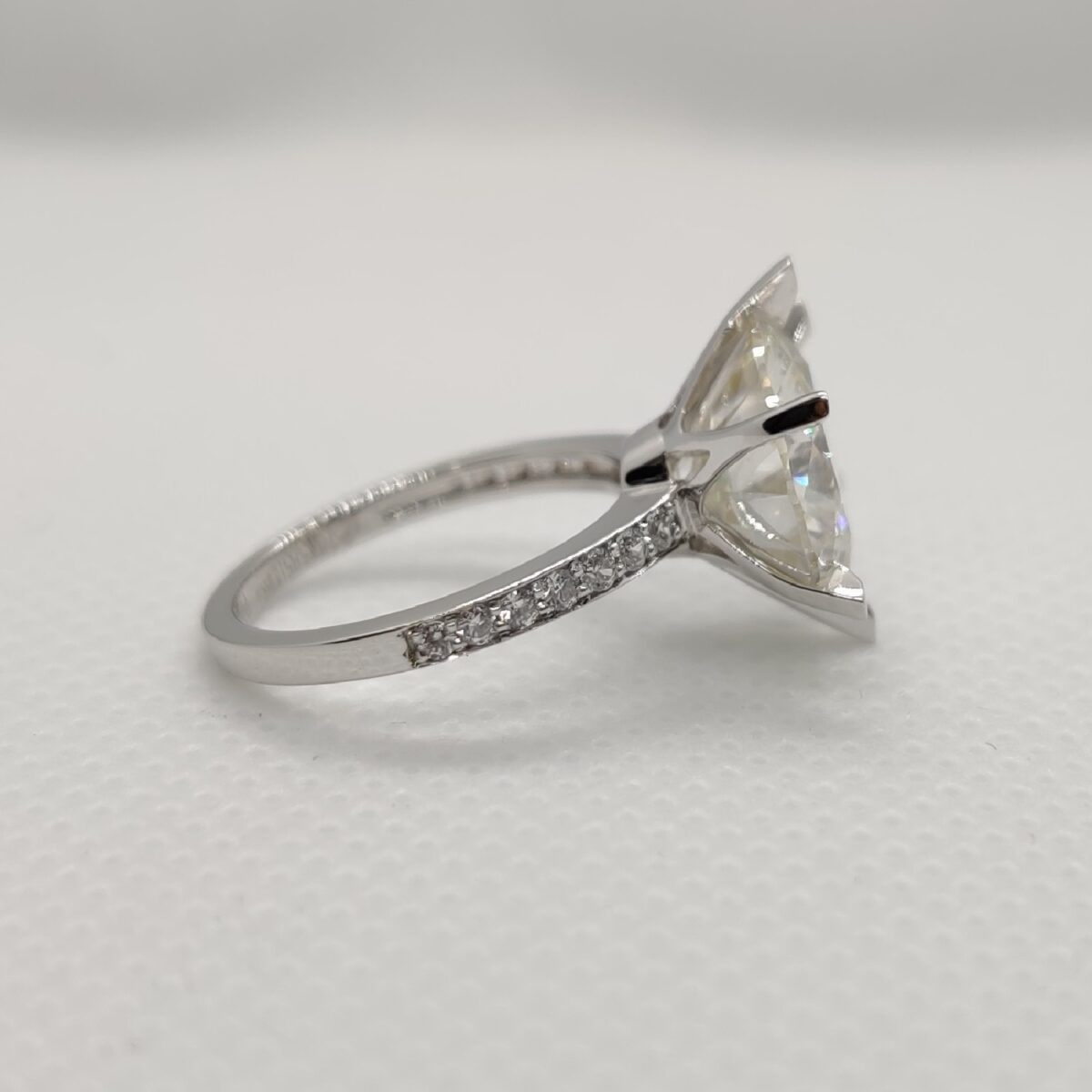 Round cut moissanite with pave setting engagement ring