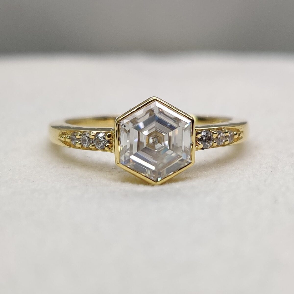 Hexagon cut bezel set moissanite engagement ring
